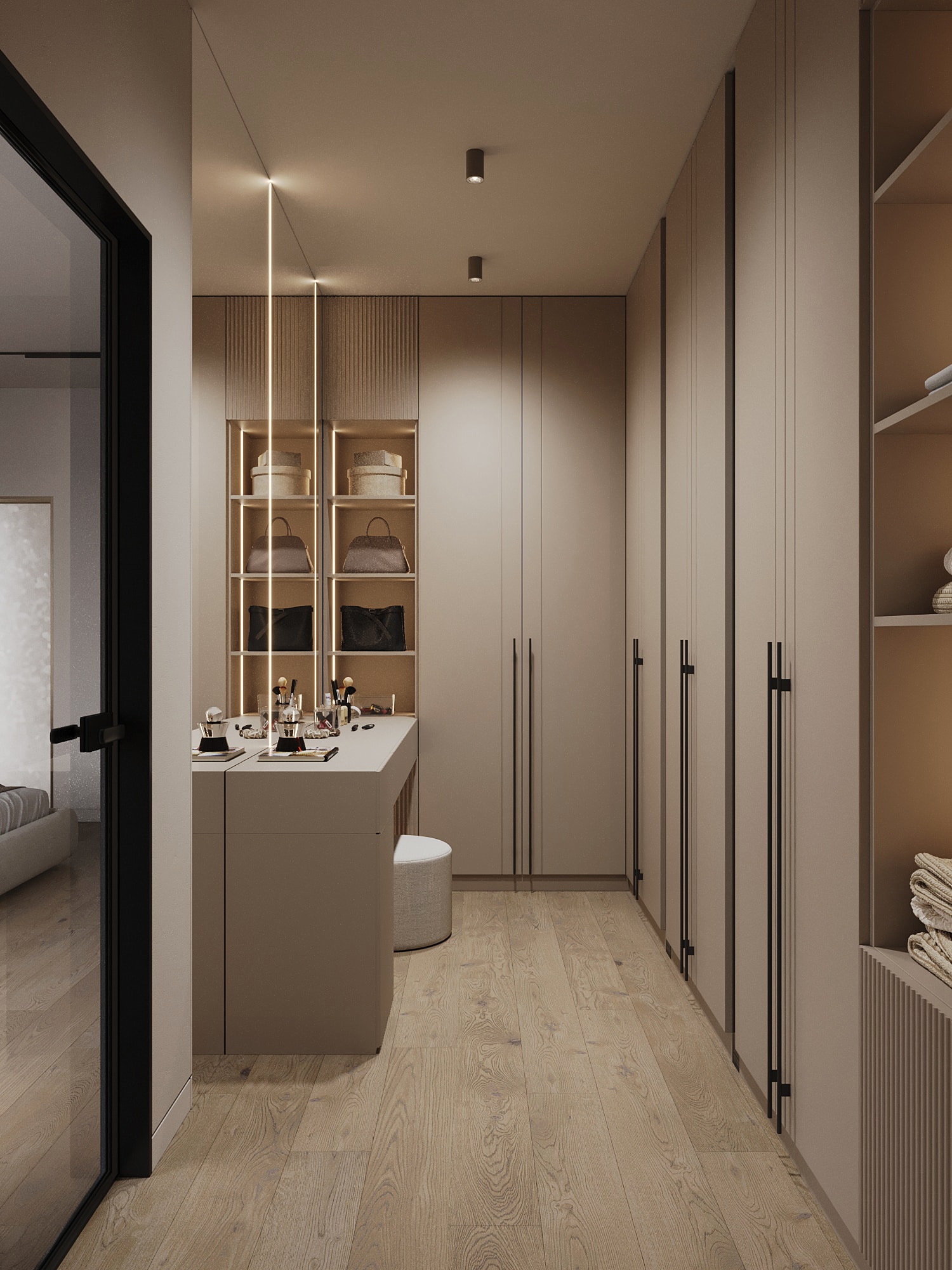 A walk-in wardrobe with a central island and oak units