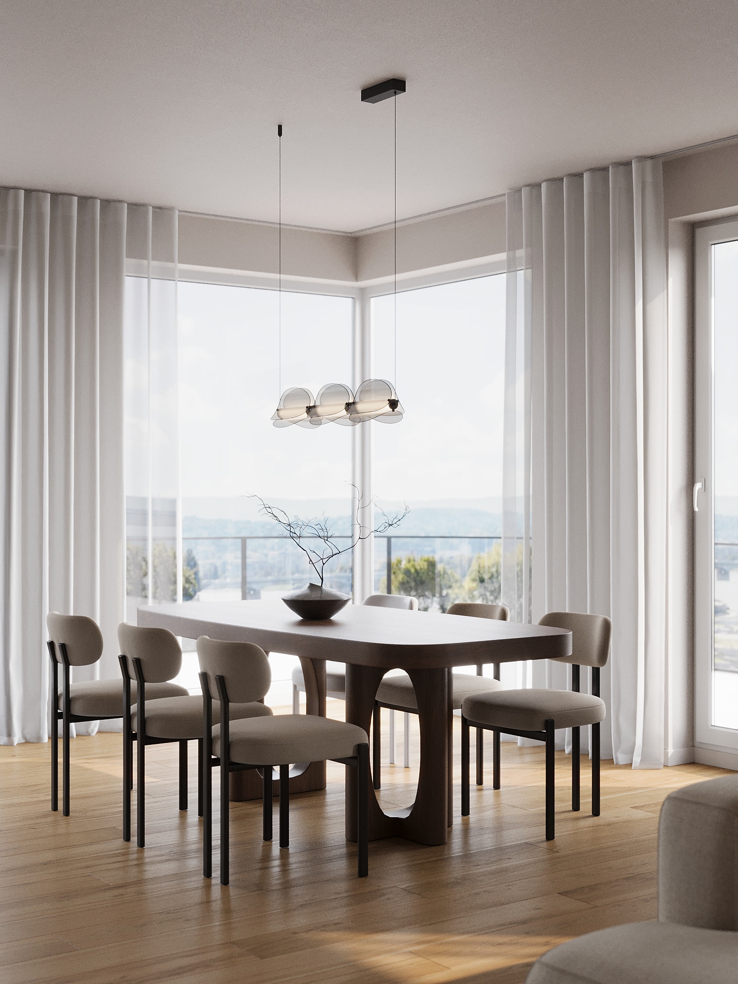 A dining table by corner windows overlooking the Danube and the Parliament