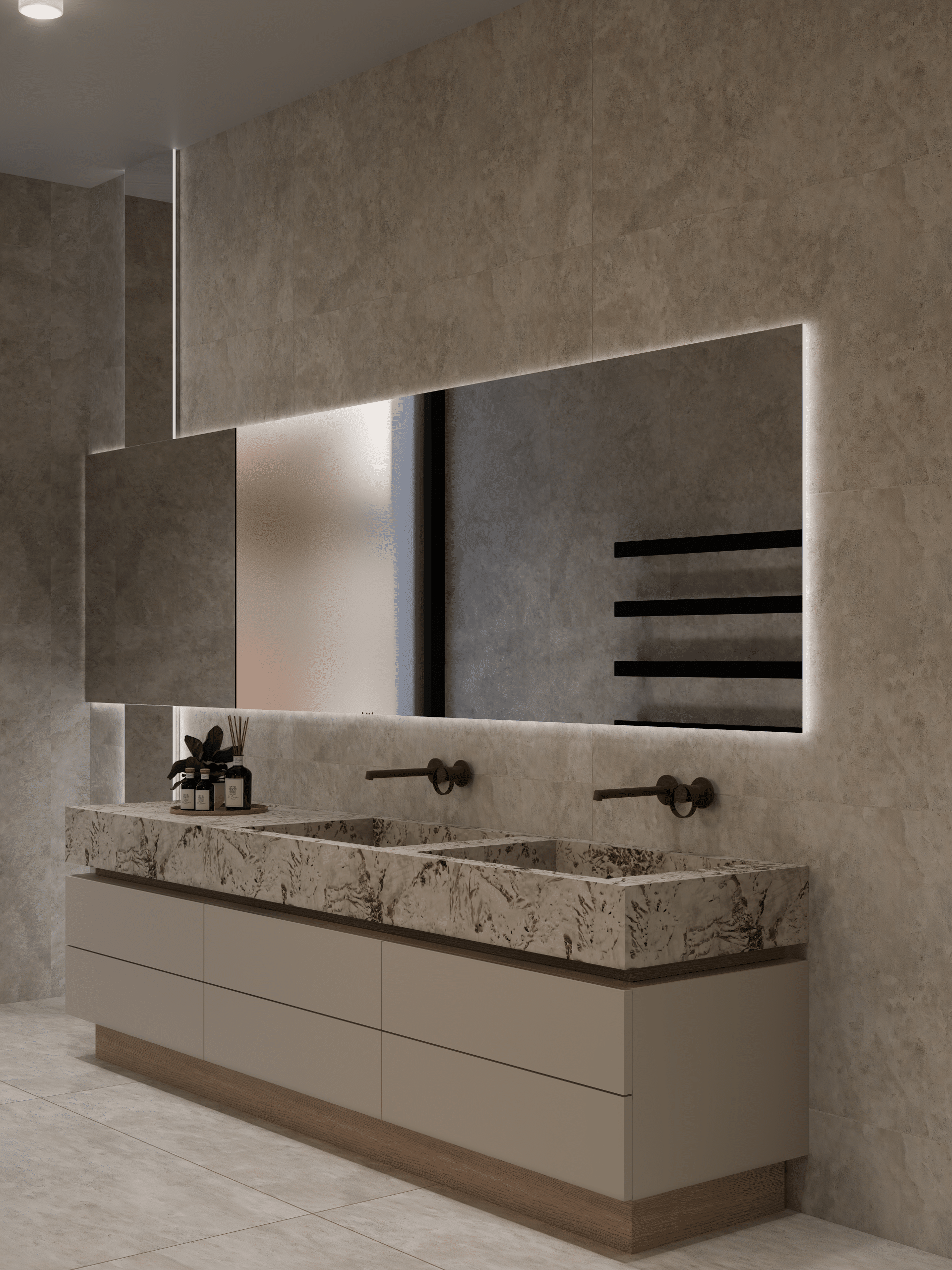 A double stone vanity with a backlit mirror